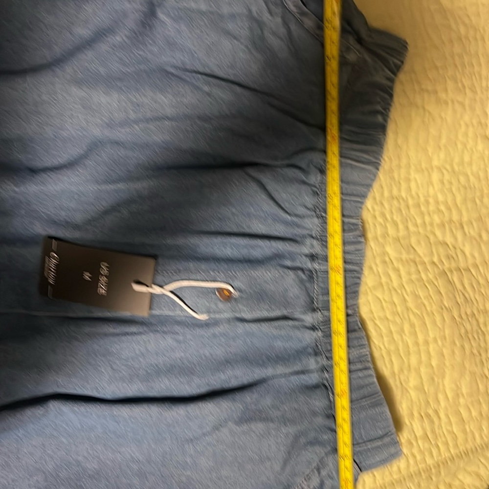 Long pleated skirt with double pockets and elastic waist